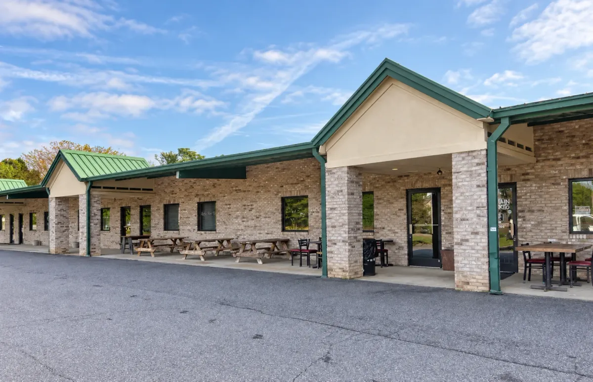 Brick storefronts and covered entrances at 408 W Fleming Dr