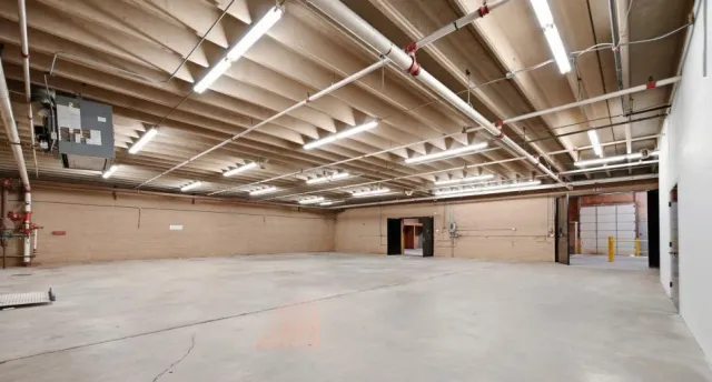 Open warehouse interior with sprinkler piping